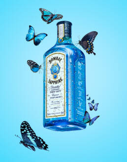 Bombay Sapphire gin bottle with condensation and butterflies