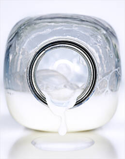 Milk bottle with milk splashing out