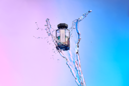 Miss Mimosa Parfum editorial water splash shot with multi-coloured background